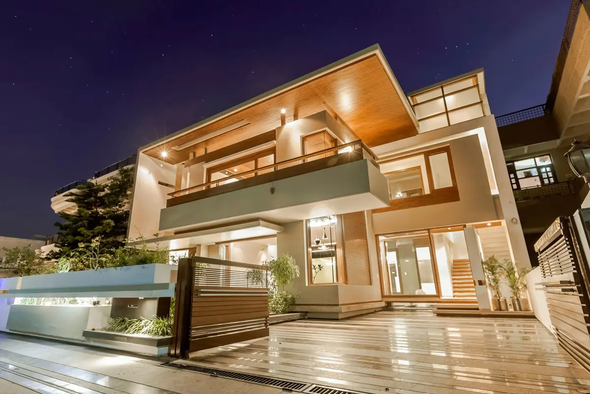 Exterior view of a two story residence with LED lights at a night scene